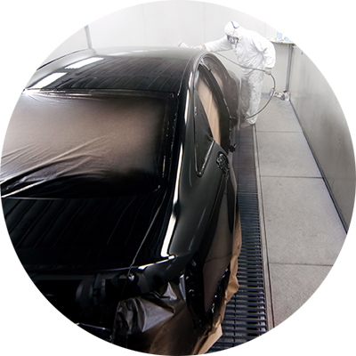 black car in spray booth